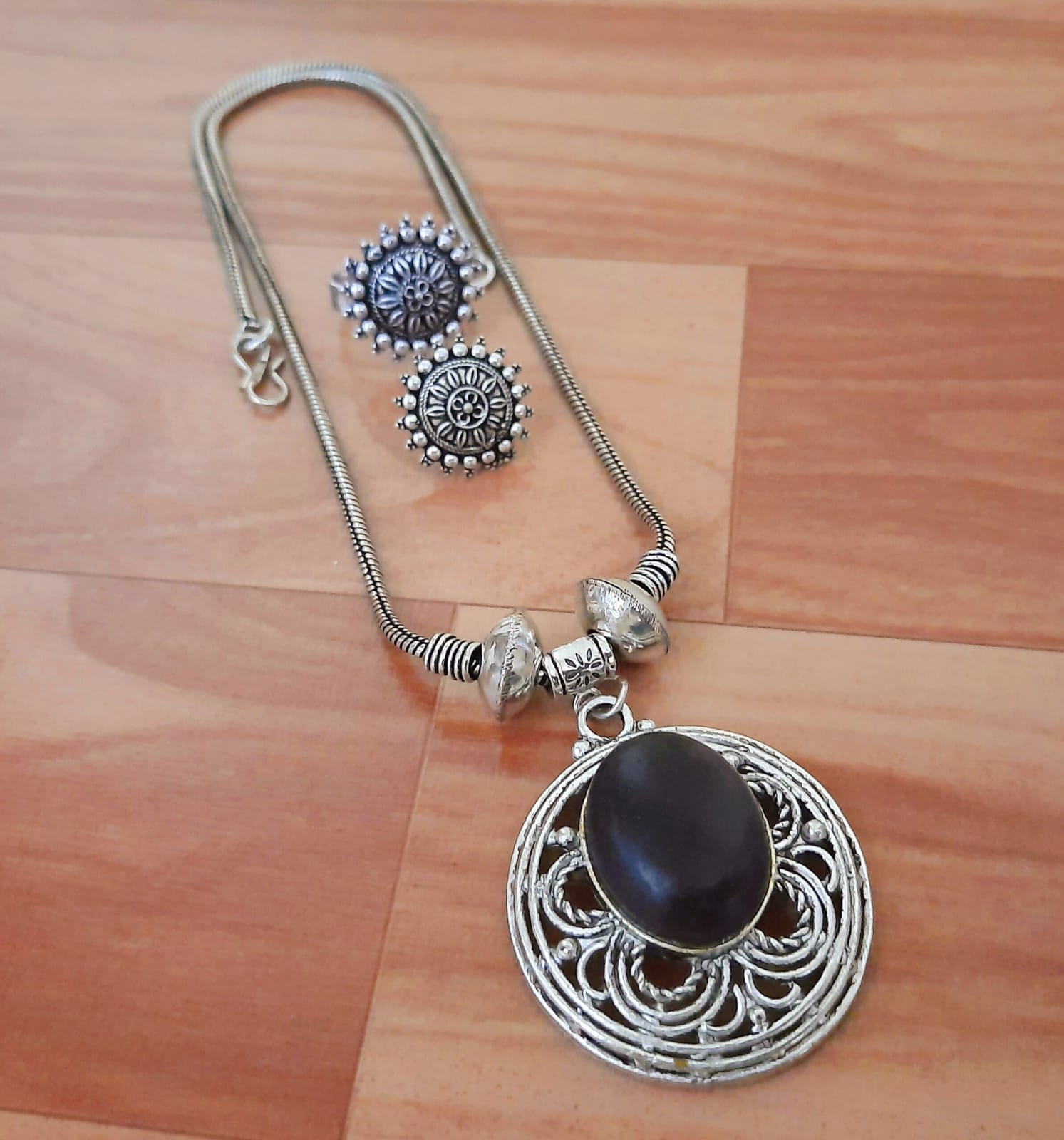 Ornate Silver Pendant Set with Gemstone